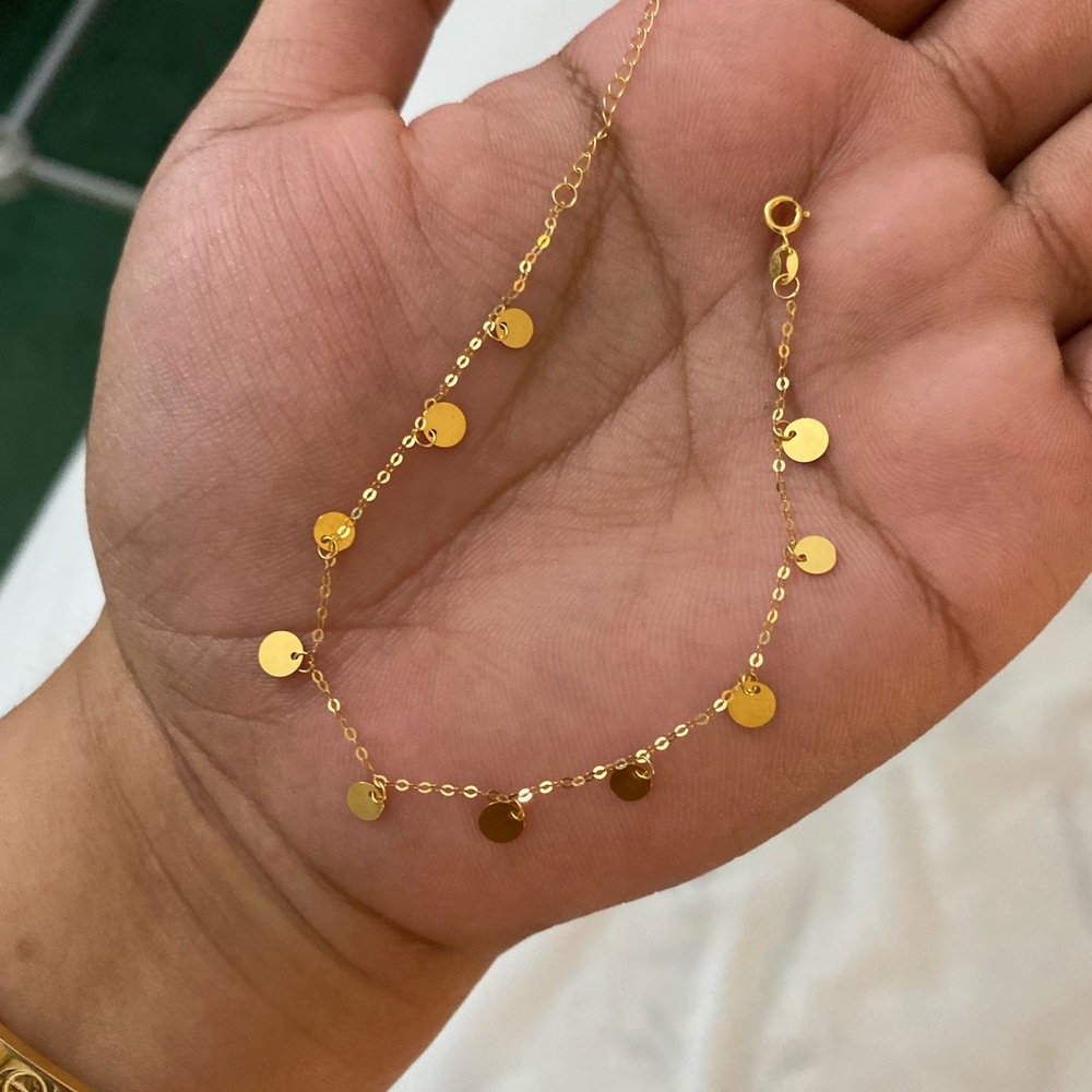 Brand new 18k yellow gold dangling bracelet